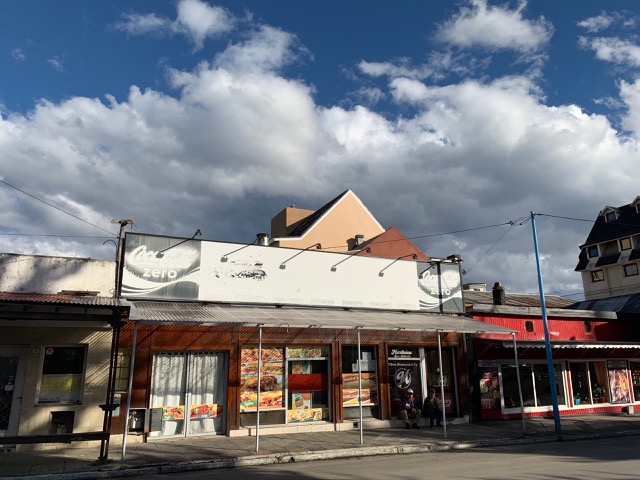 Storefront in town with Coke Zero ad