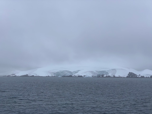 Snow capped land from afar
