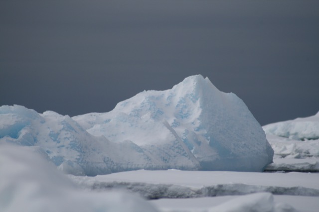 Blue ice underneath snow