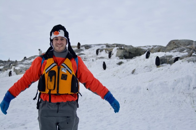 Jeremy in his penguin hat with the penguins