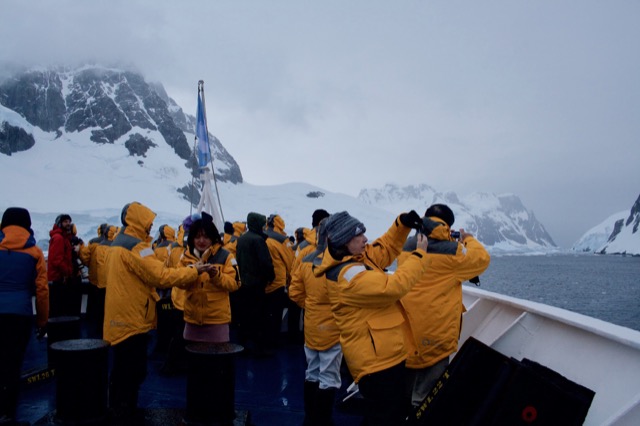 Everyone gathers on the bow of the deck