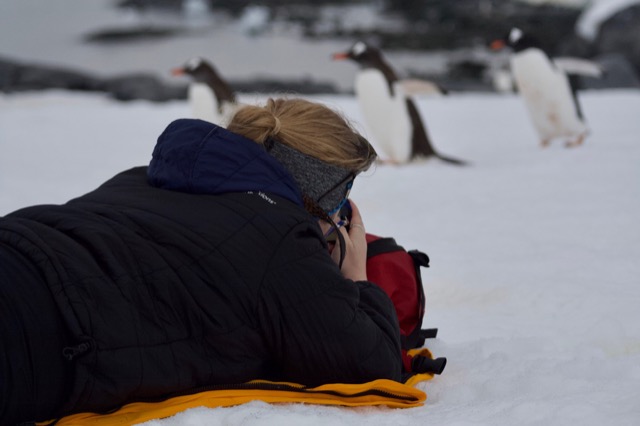 Fellow passenger laying on the ground to take pictures