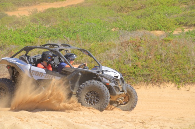 Myke kicking up sand