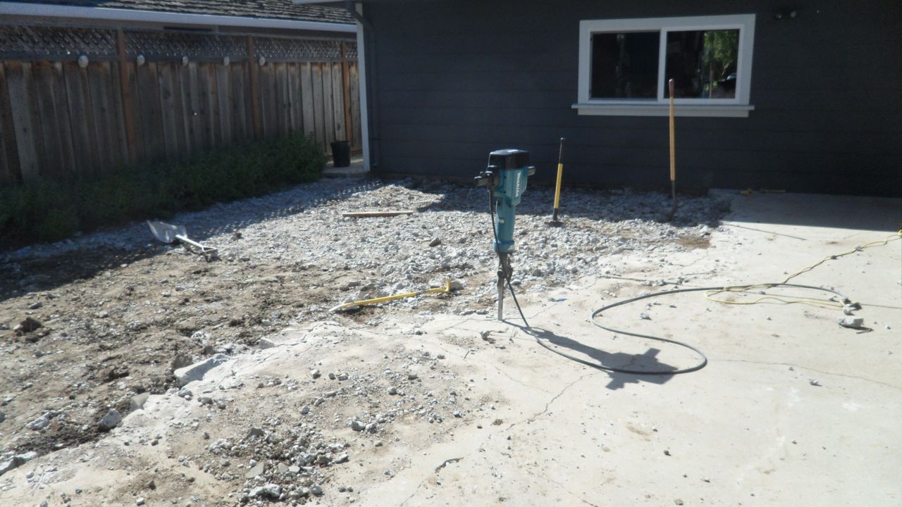 Starting to bust up concrete with jackhammer