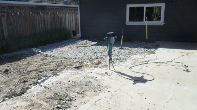 Starting to bust up concrete with jackhammer