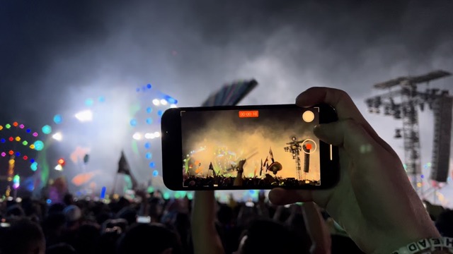Harris taking a video of Zedd's remix of Do It to It by Ariel B