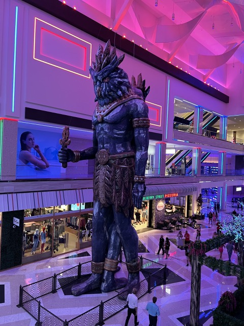 Giant EDC character in the mall area