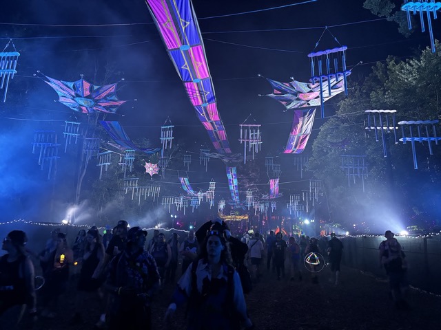 The kites and windchimes on the walk between Ranch Arena and the forest