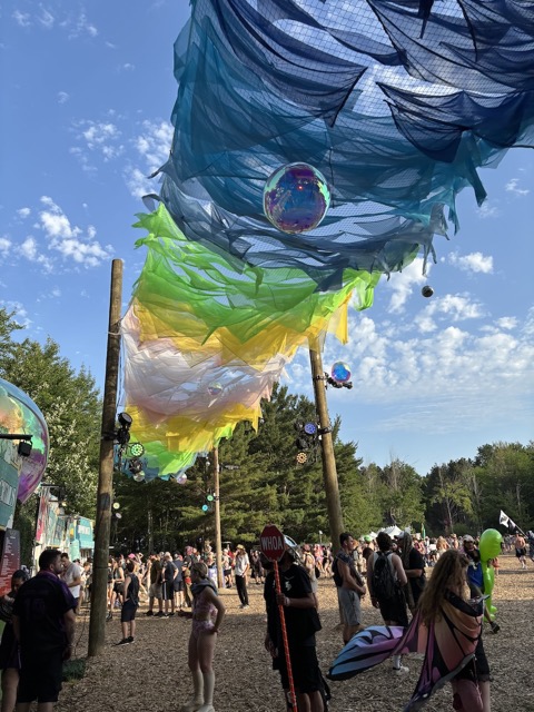 Art blowing in the wind outside of the Dream Emporium food stands