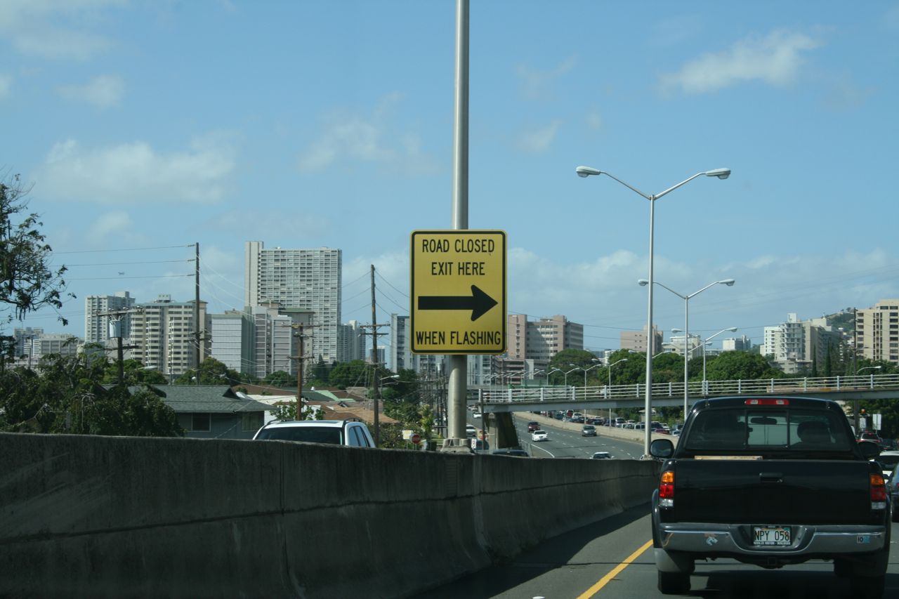 Road Closed - Exit Here When Flashing