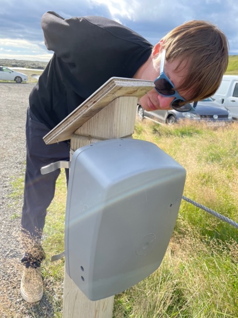Harris inspecting the person counter at the parking lot