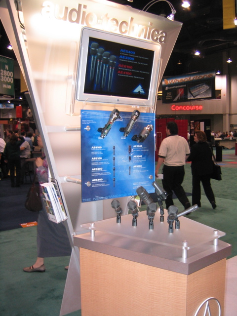 Microphones and an Apple Studio Display