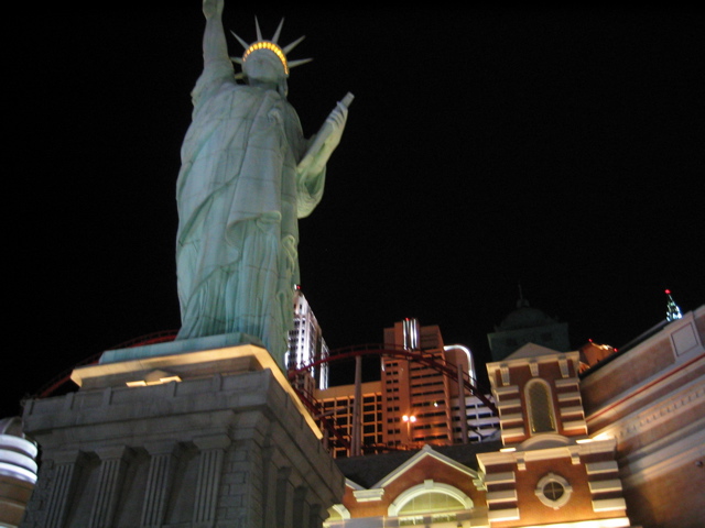 Statue of Liberty with rollercoaster in the background