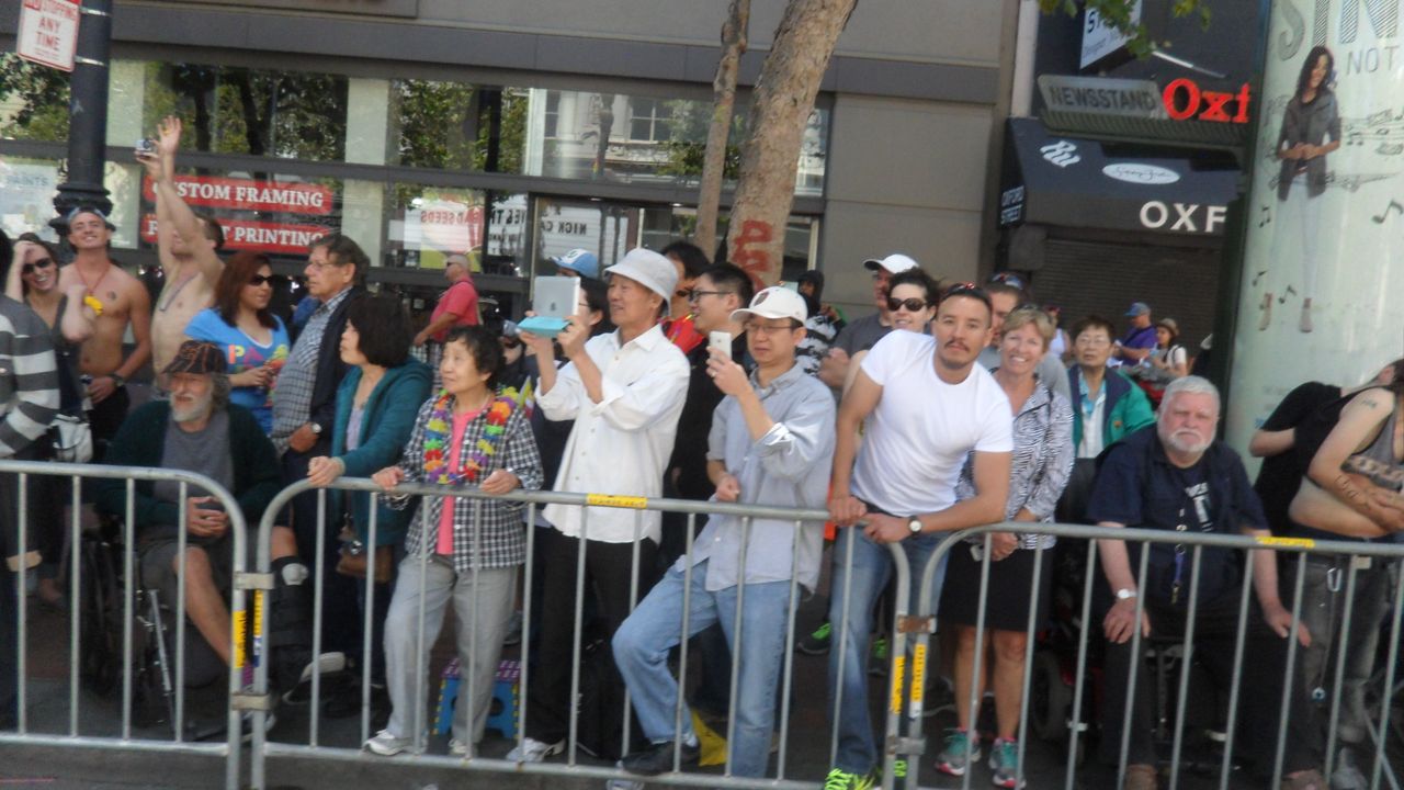 Crowd taking pictures with Apple products