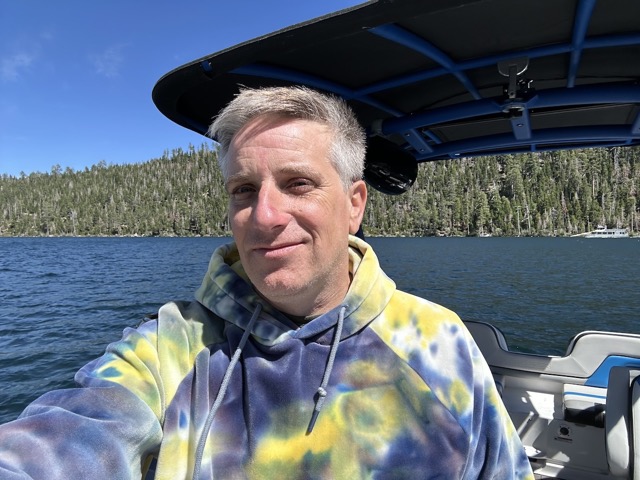 Myke, still bundled up in June to be on the lake, but worth it