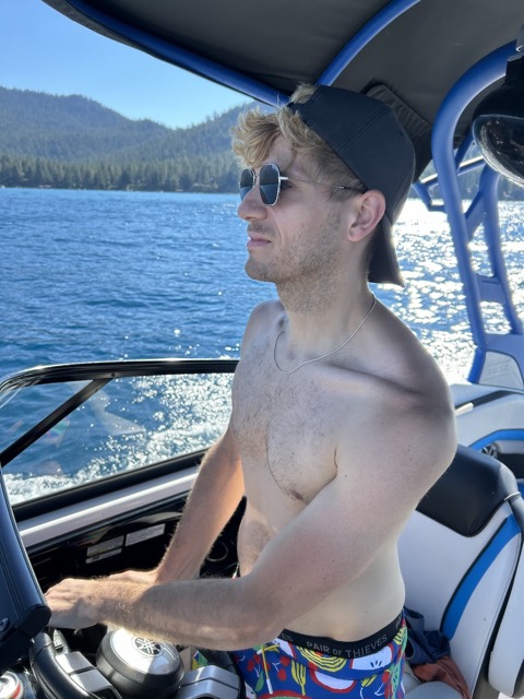 Tyler driving the boat