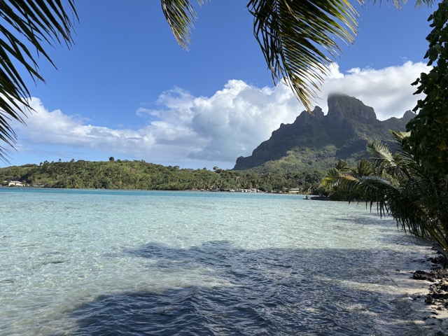 Baie Haamaire with a car junkyard off in the distance