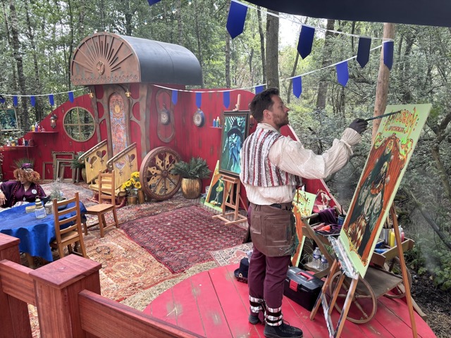 An artist paints just outside of Dreamville