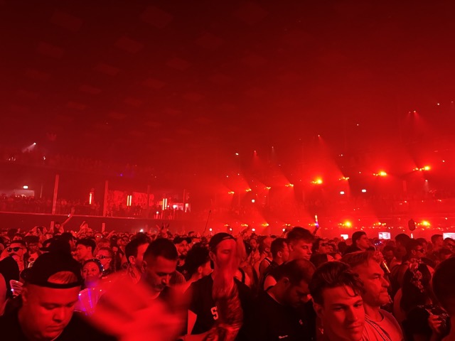 Crowd bathed in red